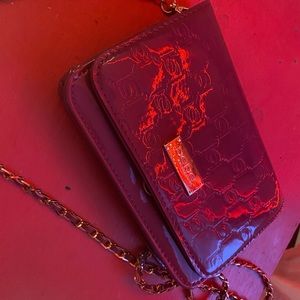 glossy BEBE shoulder purse